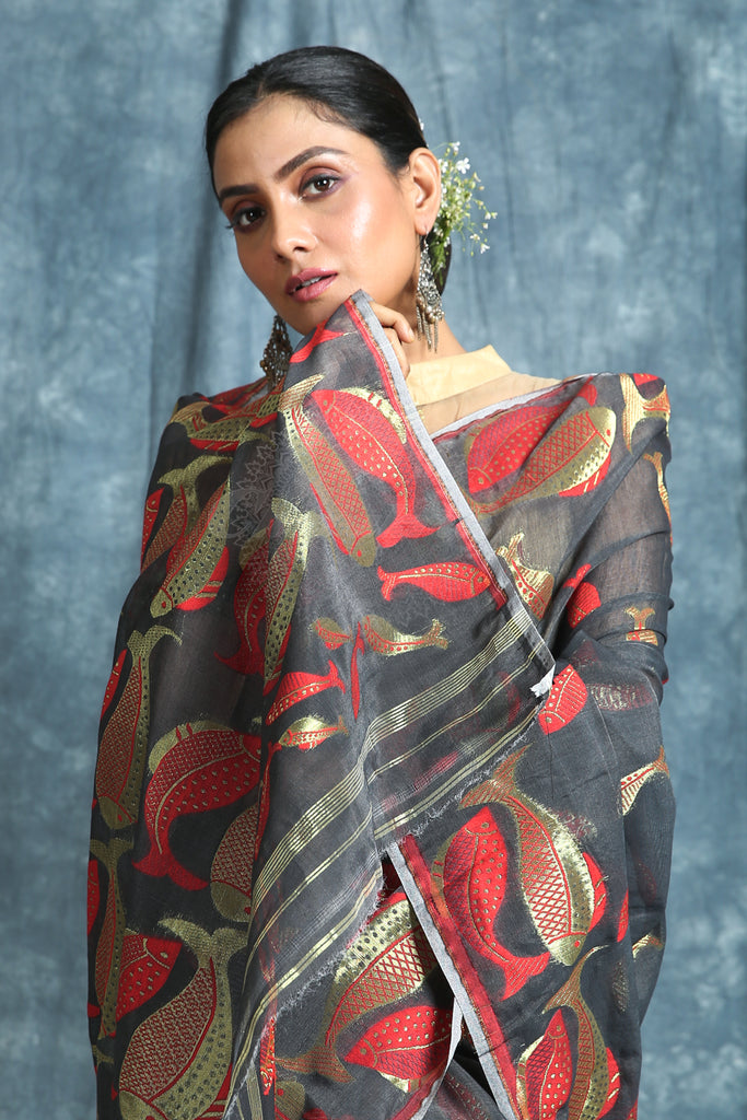 The Dark Grey Color Saree Is Crafted With Red & Golden Zari Fish Motif Work All Over The Body And Pallu - Charukriti.co.in