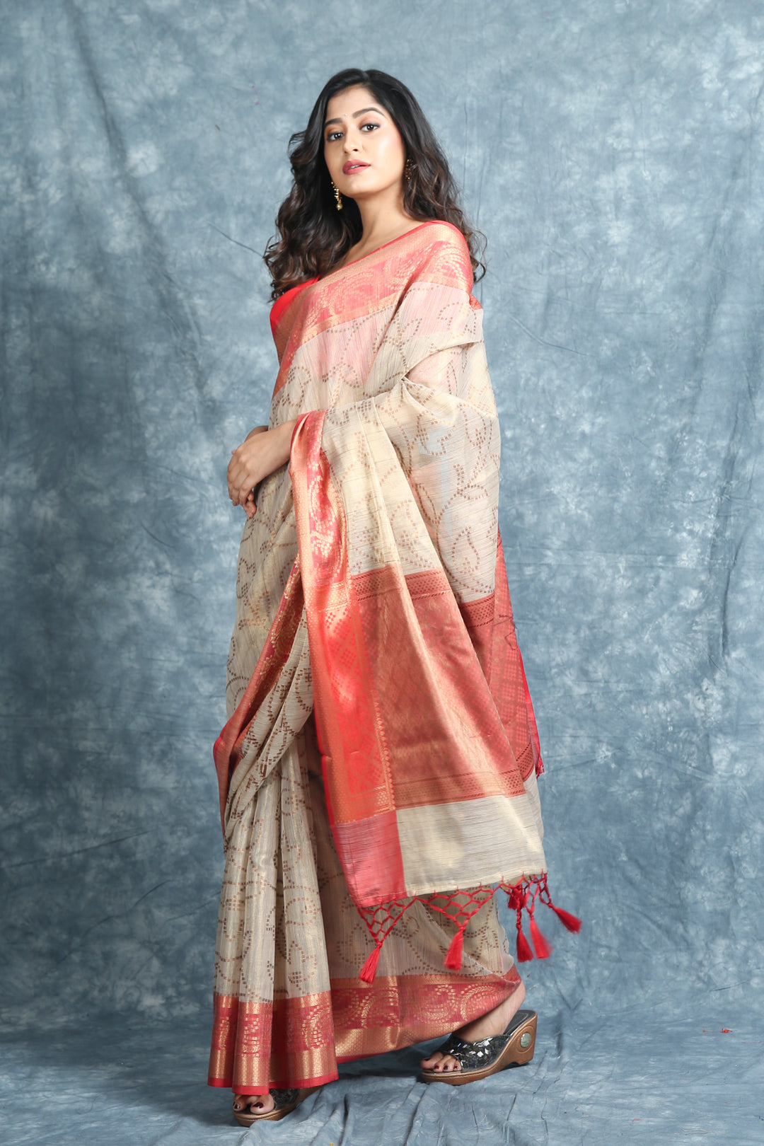 Off white Dola silk saree with allover floral print with golden tissue  border